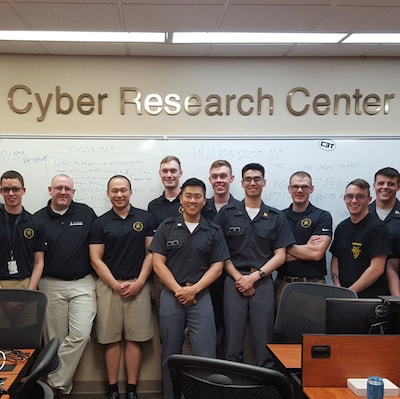 The team posing with Jim O'Gorman (President, Offensive Security).